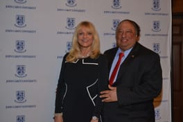 John and Margo Catsimatidis at the John Cabot University backdrop